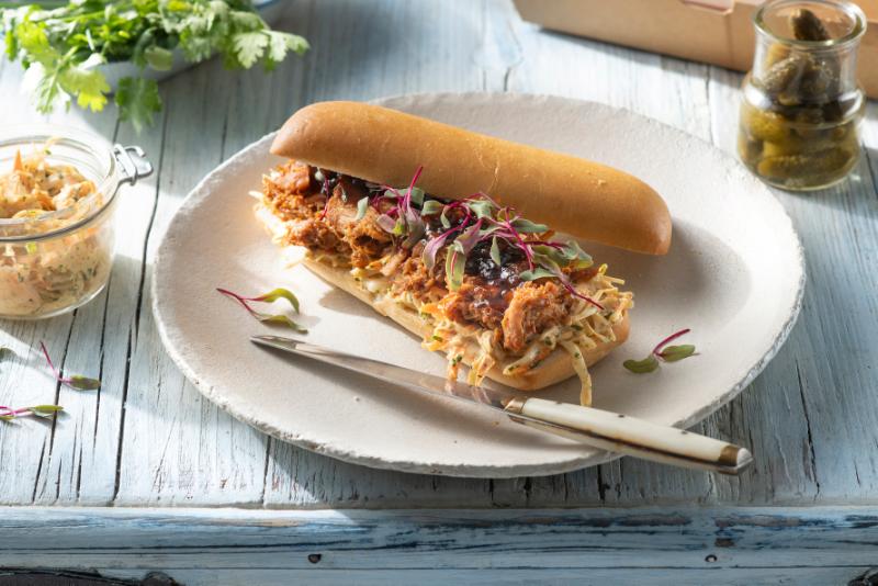 Spanish pulled pork on hot dogs